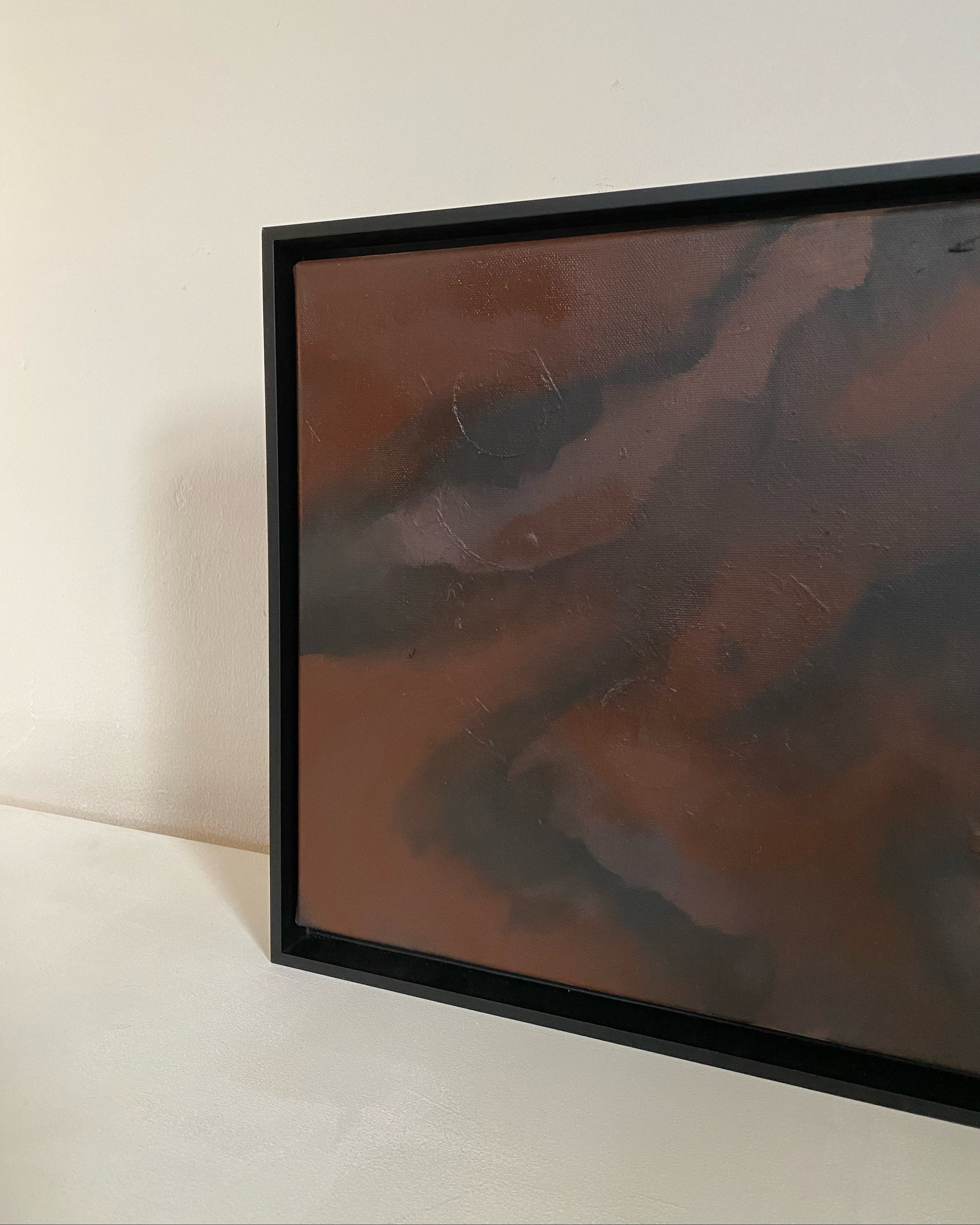 Small abstract painting in burnt sienna interior 2026